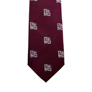 Burgundy tie with white univeristy of bristol logo pattern on a white background