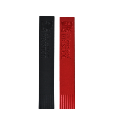 Two bookmarks, one black and one red. There is a fringe on one end and the University of Bristol logo and the words "University of Bristol" on the other. 
